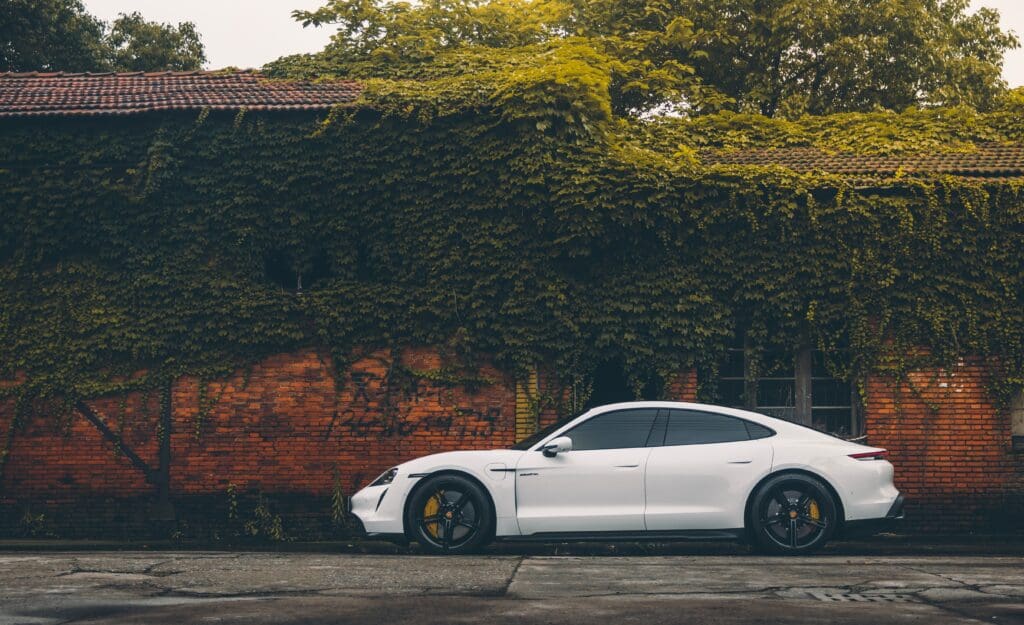 Porsche Taycan Turbo S passenger side view (wBG)